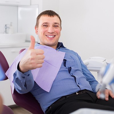 Man gives a thumbs-up to his Carrollton sedation dentist 