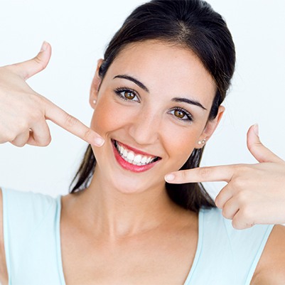 Woman pointing to health smile