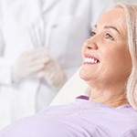 woman smiling after getting dental implants in Frisco