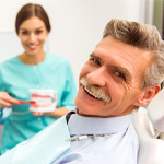 patient smiling about the cost of dentures in Frisco